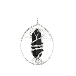 Close-up of handmade tree of life necklace with hexagonal black crystal pendant detail