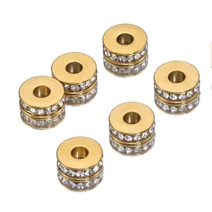 Macro view of 18k gold-plated stainless steel spacer beads with clear inlaid crystals