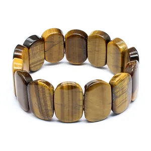 Detailed macro view showing the natural tiger's eye stone texture of the bracelet
