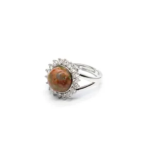Detailed macro view of an adjustable silver ring with natural stone and micro-pave crystals