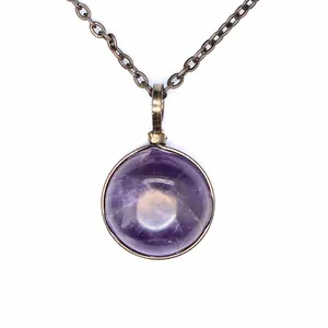 Close-up detail of retro amethyst natural stone pendant necklace with bronze chain