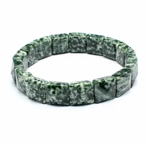 Close-up of a natural green and white marbled stone square faceted bead bracelet