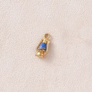 Detail shot of a vintage 3D oil lamp pendant made of gold plated stainless steel