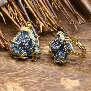 Detailed macro view of colorful agate druzy jewelry set with golden wire wrap plating