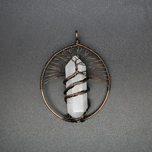 Close-up of a handmade tree of life wire-wrapped crystal hexagonal column pendant