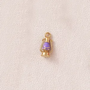 Detailed macro view of a 3D gold-plated stainless steel purple oil lantern charm