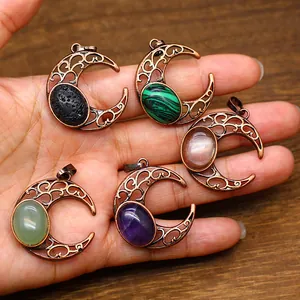 Close-up of antique hollow moon pendants featuring various colorful natural stones.