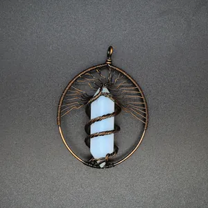 Detail of handmade Tree of Life copper wire wrapped pendant with opalite pillar