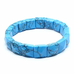 Close-up of square faceted blue turquoise-style stone bracelet with black veins