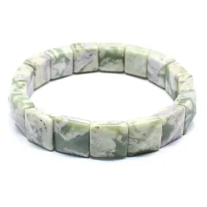 Close-up of natural stone bracelet with green and purple marble square beads