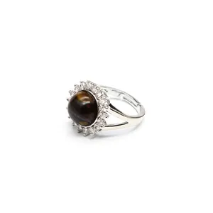 Detailed side view of adjustable silver sunflower ring with dark tiger eye stone