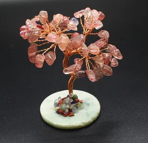Detailed view of handmade copper wire tree with chakra crystals and calcite base