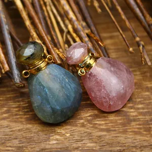 Detailed macro view of faceted natural stone perfume bottle pendants on rustic wood surface