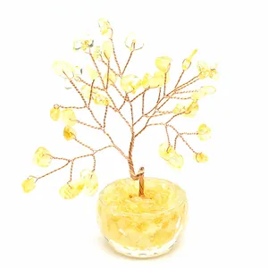 Detailed view of a yellow citrine crystal money tree with hand-twisted copper wire branches