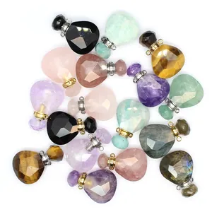 Macro view of various faceted natural stone perfume bottle pendants with metal caps