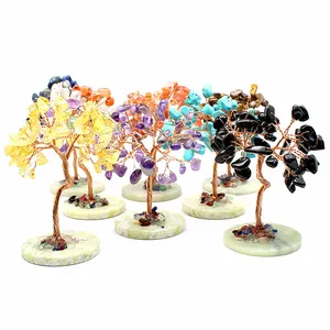Collection of seven mini chakra gemstone trees on round calcite bases in various colors