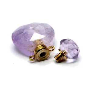 Detailed view of faceted amethyst heart essential oil diffuser pendant with gold screw top