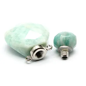 Detailed view of faceted green natural stone aromatherapy pendant with metal screw cap