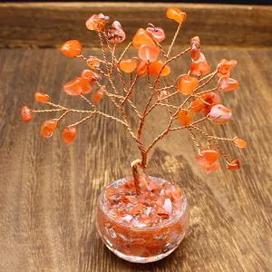 Detailed view of handmade crystal money tree with orange stones and copper wire