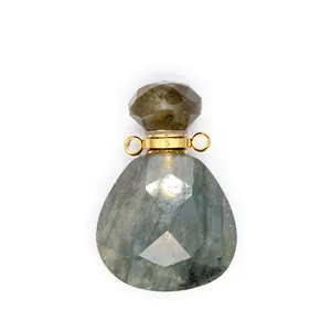 Macro detail of a faceted natural stone teardrop essential oil diffuser bottle pendant.