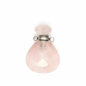 Macro view of faceted natural rose quartz perfume bottle pendant diffuser jewelry