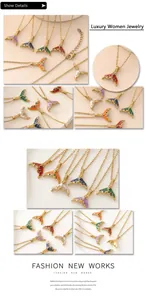Detailed macro view showing various colorful enamel mermaid tail pendants with gold plating and crystals