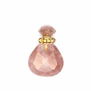 Close-up detail of a faceted strawberry quartz waterdrop essential oil diffuser pendant