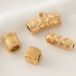 Close-up of assorted gold-plated stainless steel beads for DIY jewelry making.