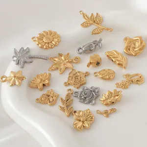 Detailed view of assorted gold plated stainless steel leaf and flower charms for DIY jewelry