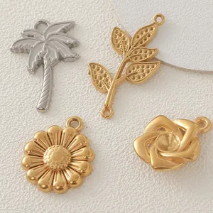 Detail shot of stainless steel gold plated leaf and flower charms for DIY jewelry
