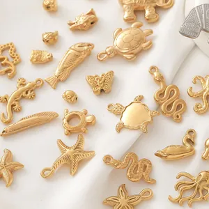 Detail view of assorted 18K gold animal charms for DIY jewelry making accessories