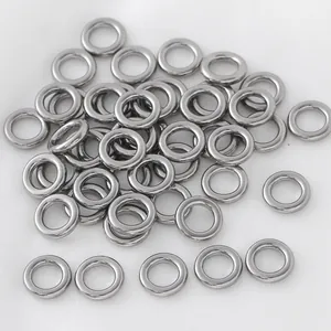 Detailed view of polished stainless steel closed jump rings for jewelry making DIY