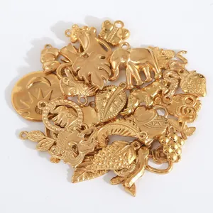 Detailed view of 18K gold plated stainless steel charms in animal and nature shapes