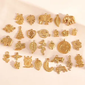 Detailed view of diverse 18K gold plated stainless steel charms for DIY jewelry making.
