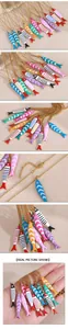 Detailed macro view of colorful enamel fish pendant necklaces with striped patterns