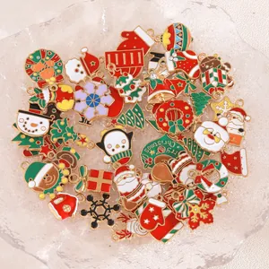Detailed close-up view of various colorful enamel Christmas charms and DIY pendants