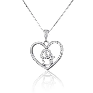 Detailed view of silver heart necklace with zircon-studded dog silhouette design