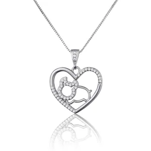 Detailed view of silver heart necklace with zodiac pig and sparkling zircon stones