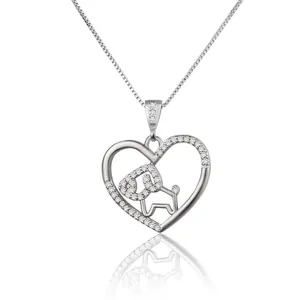 Detail of silver heart necklace featuring stone-encrusted dog pendant and box chain