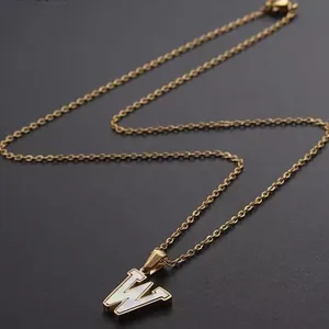Elegant gold link chain necklace with a pearl white shell letter W pendant charm