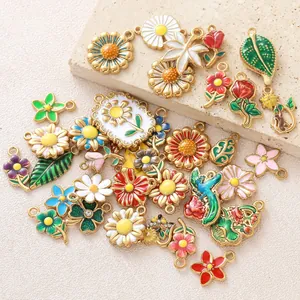 Vibrant macro view of various enamel flower charms including daisies, roses and sunflowers