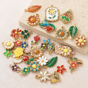 Detailed view of colorful enamel flower and leaf charms for custom jewelry making sets