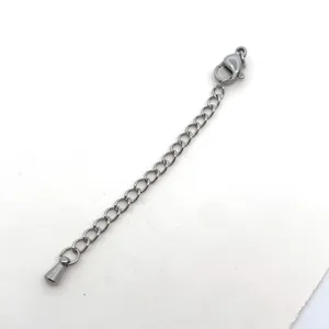 Detail view of a 7cm stainless steel extender chain with lobster clasp and cone pendant