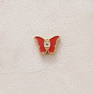 Red enamel butterfly charm with evil eye in gold-plated stainless steel for DIY