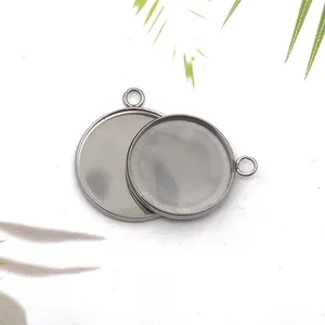 Detailed macro shot of silver stainless steel round pendant bezel trays for jewelry DIY