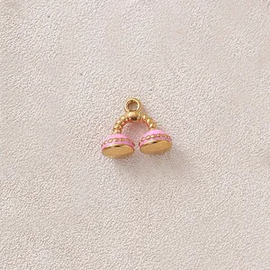 Close-up of pink enamel gold-plated stainless steel phone-shaped charm pendant