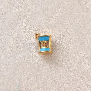 Close-up detail of a gold-plated stainless steel hourglass charm with blue enamel