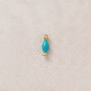 Detail view of a gold-plated stainless steel turquoise candy enamel charm for DIY jewelry
