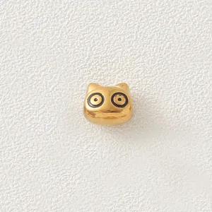 Detailed macro view of a gold-plated stainless steel cartoon animal bead for DIY jewelry