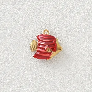 Detailed view of a red enamel fish charm with gold-plated finish for DIY jewelry